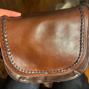 Never used but has been stored in a suitcase along with other purses. One mark.